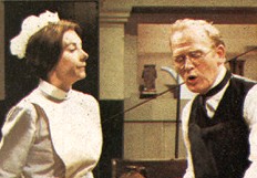 photo of head butler mr. hudson scolding the other servants